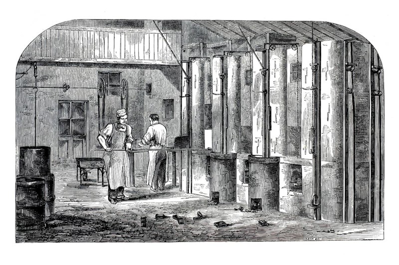 19th century illustration shows the muffle oven room in a steel spring factory. On the right side, you can see the large, vertical ovens. In the manufacture of steel springs, the annealing and subsequent hardening of the steel in such closed muffle furnaces was a decisive step for the strength of the nibs, authentic, high-resolution reproduction from a 19th century original, exact date of presentation unknown, historical