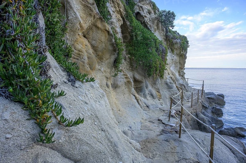 Road along the coast with beautiful rock formations to, Capo Sant Andrea, Marciana, Livorno Province, Italy