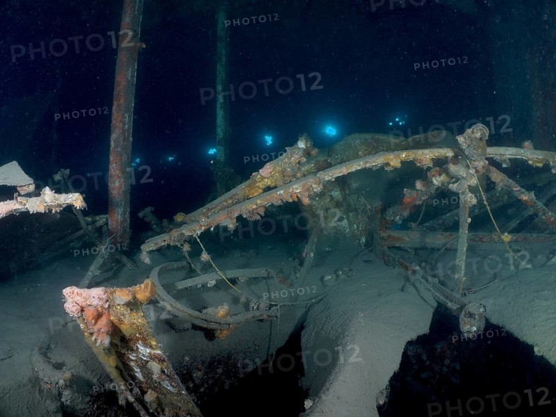 Weathered remains of a wreck under water, overgrown by algae, mysterious darkness. Wreck of the Vis dive site, Pula, Croatia, Mediterranean Sea