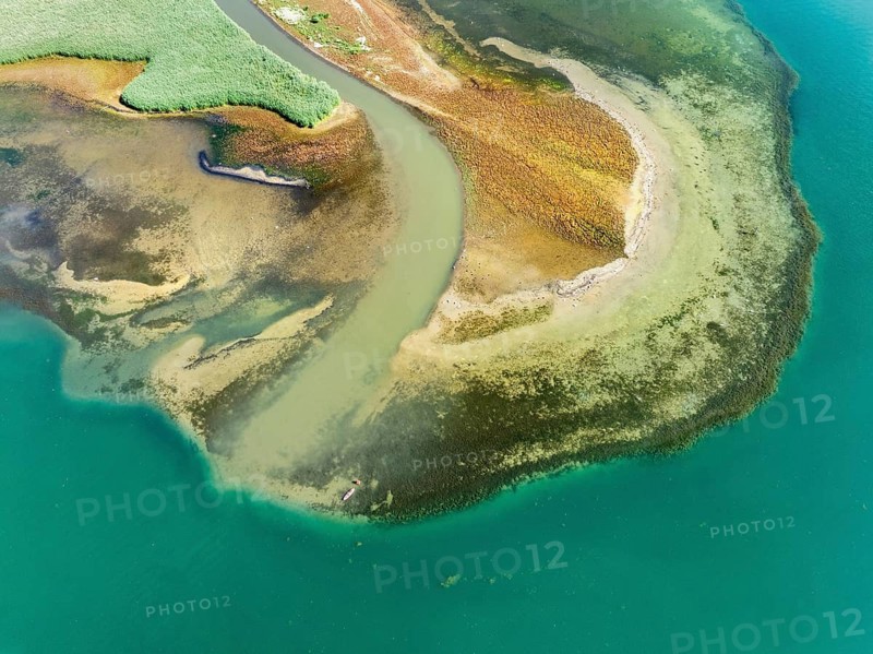 Aerial view, top-down view of the mouth of the Stockacher Aach at low tide flowing into Lake Überlingen. As a result of the deposits of entrained suspended matter and sediments from the inflow, the shore zone near Bodman-Ludwigshafen is gradually silting up. Lake Constance, District of Konstanz, Baden-Württemberg, Germany