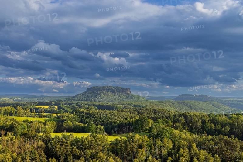 View of Lilienstein from Gamrig sandstone rock in rainy weather and sunshine, Rathen, Saxony, Germany