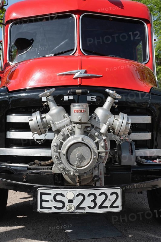 Historic fire engine during the 12th state fire department classic car meeting on Karlsruhe Castle Square. A stem pump from the manufacturer Ziegler on an Opel Blitz round hood vintage fire engine from the 1950s. Karlsruhe, Baden-Württemberg, Germany