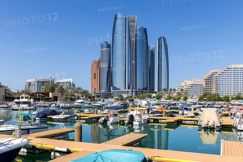 Abu Dhabi Skyline Etihad Towers skyscrapers with marina yacht harbor in Abu Dhabi, United Arab Emirates