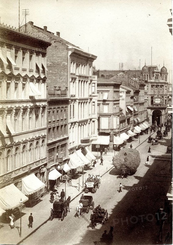 Berlin, Mitte, Friedrichstraße, background, panopticon, city street with horse-drawn carriages and passers-by as well as typical rows of historic buildings, 1890