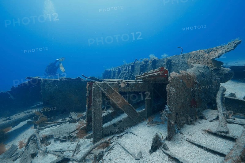 A diver explores the broken parts of an old shipwreck underwater, meteor wreck dive site, Russian hydrofoil, Arguineguin, Gran Canaria, Spain, Europe, Atlantic