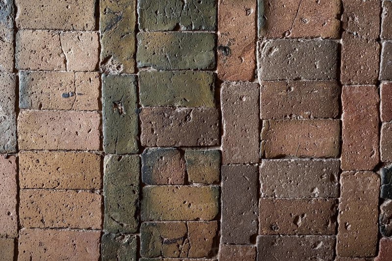 Detailed view, floor with old earth-colored bricks crisscrossed by cracks, church, Husby Church, Husby, Holstebro Municipality, Denmark