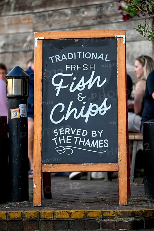 Fish & chip sign in front of an outdoor restaurant on the Thames, South Bank, London, England, Great Britain, Great Britain