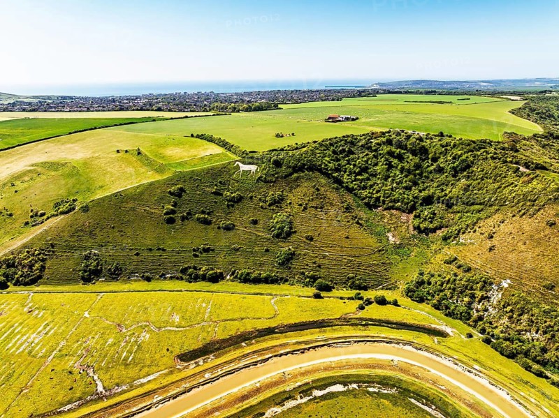 Litlington White Horse over Cuckmere Valley from a drone, Hindover Hill, South Downs, East Sussex, England, United Kingdom