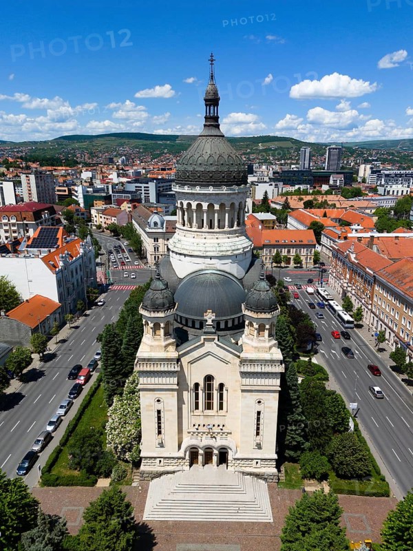 Central church with a distinctive tower in the midst of a lively urban landscape under slightly cloudy sky, aerial view, Metropolitan Cathedral of the Assumption of Mary, Cluj-Napoca, Cluj, Transylvania, Transylvania region, Romania