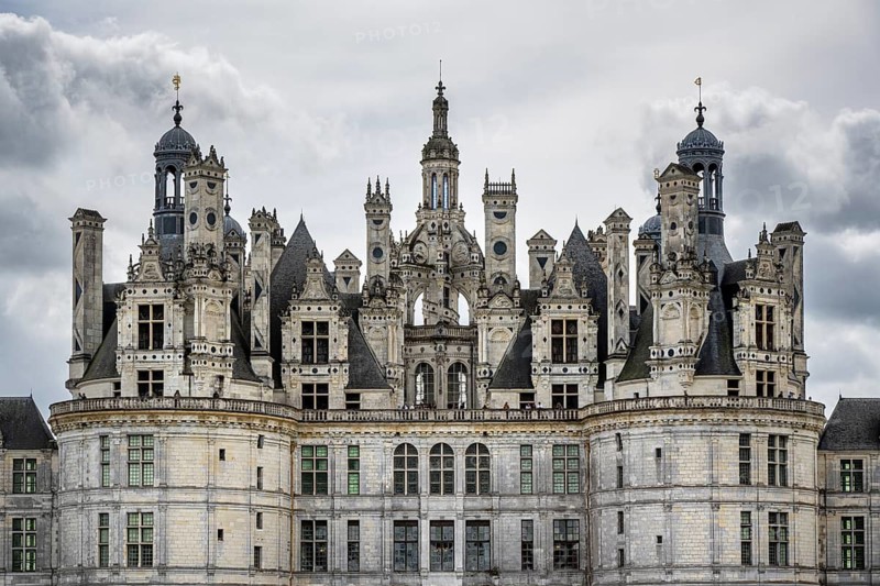 Northwest view, detailed view of the monumental Renaissance Château de Chambord castle with its distinctive, richly decorated roof silhouette of numerous towers, chimneys and dormers, Chambord Castle, Blois Arrondissement, Loir-et-Cher department, Centre-Val de Loire region, France