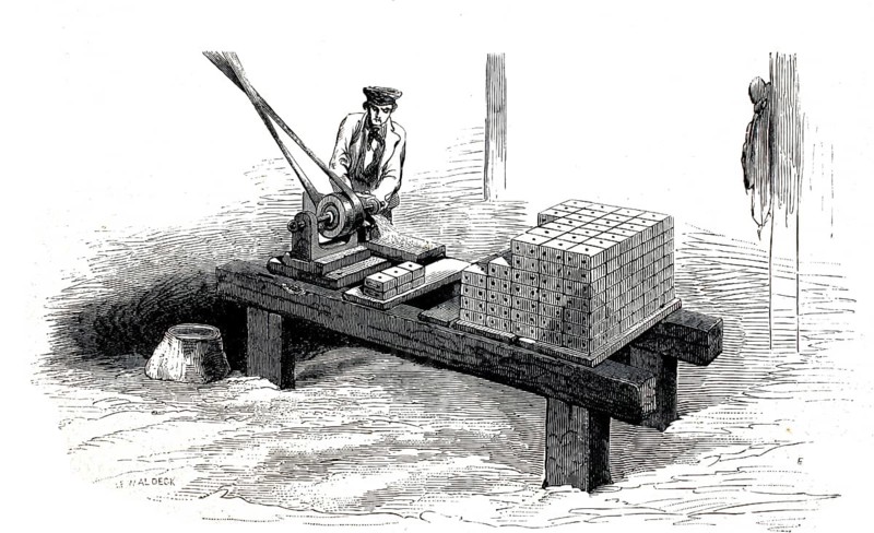 A mortising machine or milling machine for woodworking, used for drilling mortises for ship's fittings. On the right-hand side of the workbench, precisely prefabricated, pre-drilled wooden blocks are stacked up. Historically, this setup was used, amongst other places, in large sawmills (such as the City Sawmills in London) to produce standardised ship's blocks (pulley blocks for shipping) or components for mechanical engineering, 1860, authentic, high-resolution reproduction of a 19th-century original, exact date of the illustration unknown, historical