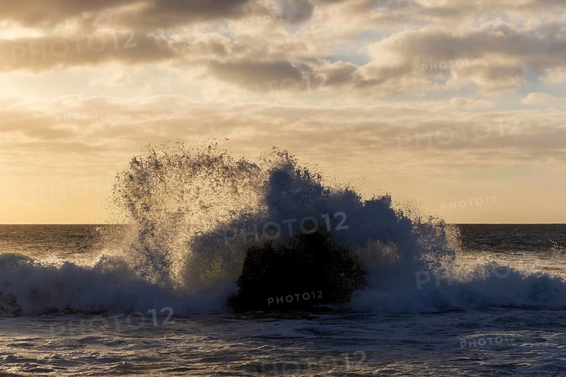 Lanzarote, Canary Islands, Spain, Europe, Los Hervideros, waves hitting a rock in the sea at sunset
