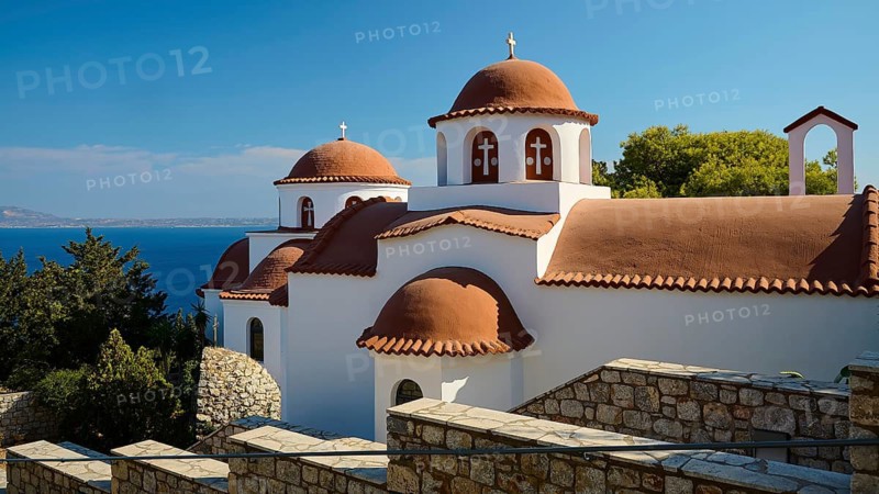Agiou Sarvas monastery, white-brown church with domes and sea view, surrounded by stone walls, Pothia, main town, port, Kalymnos, Sponge Diving Island, Dodecanese, Greek Islands, Greece