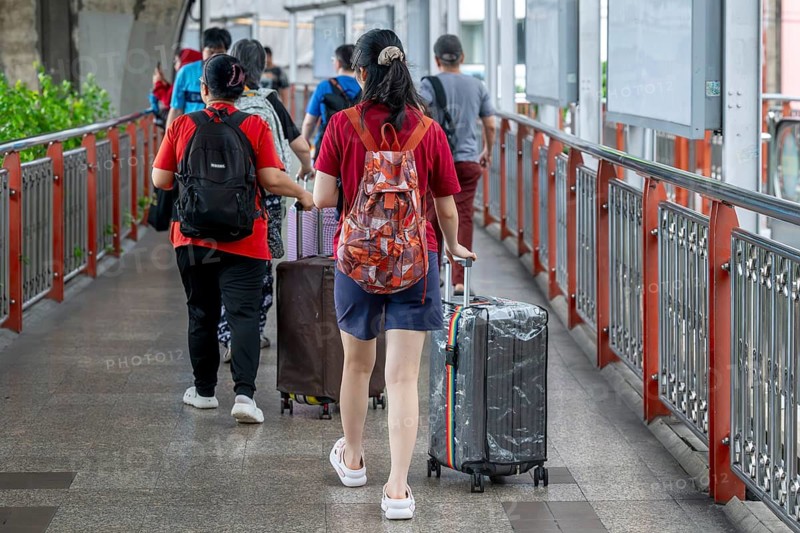 Tourists with luggage, Bangkok, Thailand