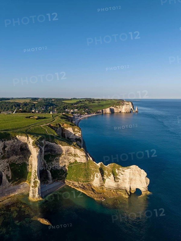 Aerial view of the Falaise d'Amont rock formation with the Porte d'Amont rock gate, Porte d'Aval rock formation, Étretat, Alabaster Coast, La Côte d'Albâtre, chalk cliffs, English Channel, Seine-Maritime, Normandy, France
