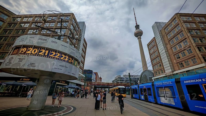 People on Alexanderplatz with a view of the World Clock, the Berlin TV Tower and a tram, Alexanderplatz, Berlin