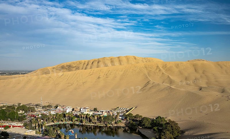 The oasis, Laguna Huacachina with a small lake and houses surrounded by sand dunes in the Ica region, coastal desert, southern Peru, Peru, South America