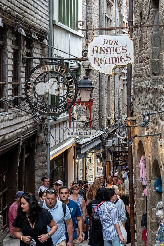 Mass tourism in the historic alleys of Rocky Island, Le Mont Saint Michel monastery island, tourist attraction, UNESCO World Heritage Site, Pontorson, Manche department, Normandy, France