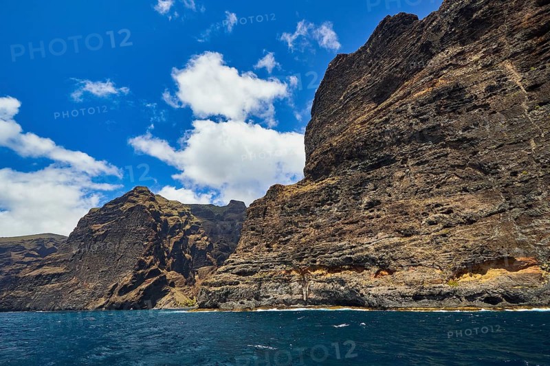 Los Gigantes, high rocks with distinctive cliffs under a cloudy sky over the sea, whale watching boat tour, whale watching, dolphins, west coast, Tenerife, Canary Islands, Spain