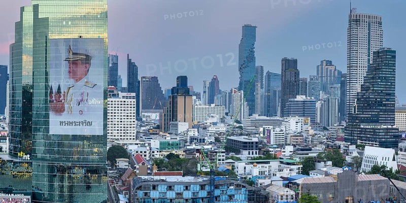 Panoramic sunset view from IconSiam over Mae Nam Chao Phraya to Bangkok's skyline. On display include the MahaNakhon Tower, the State Tower, the Lebua at State Tower and numerous modern skyscrapers along the riverbank, skyline of Bangkok, Thailand
