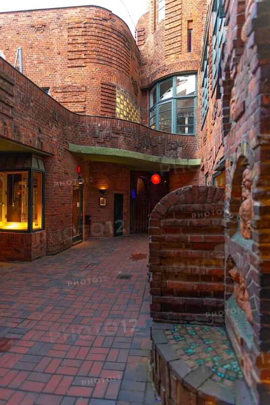 Courtyard in the historic Böttcherstraße in the old town of the Hanseatic City of Bremen from the 1920s, example of clinker expressionist architecture, artistic design, brick architecture, rounded corners, popular tourist destination