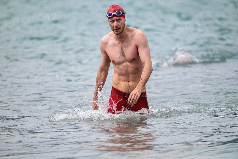Swimmer comes out of the water after the swimming stage, Tegernsee Triathlon, Tegernsee, Upper Bavaria, Bavaria, Germany