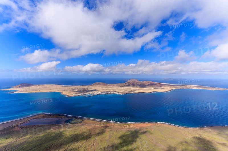 Lanzarote, Canary Islands, Spain, Europe, Mirador del Rio, Graciosa Island, A view of an island with vast sea and cloudy sky