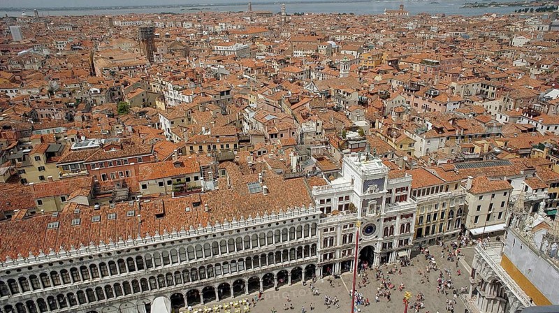 View from above of St. Mark's Square and the rooftops of Venice, Historic Square full of people surrounded by impressive architecture, Venice, Veneto, Italy