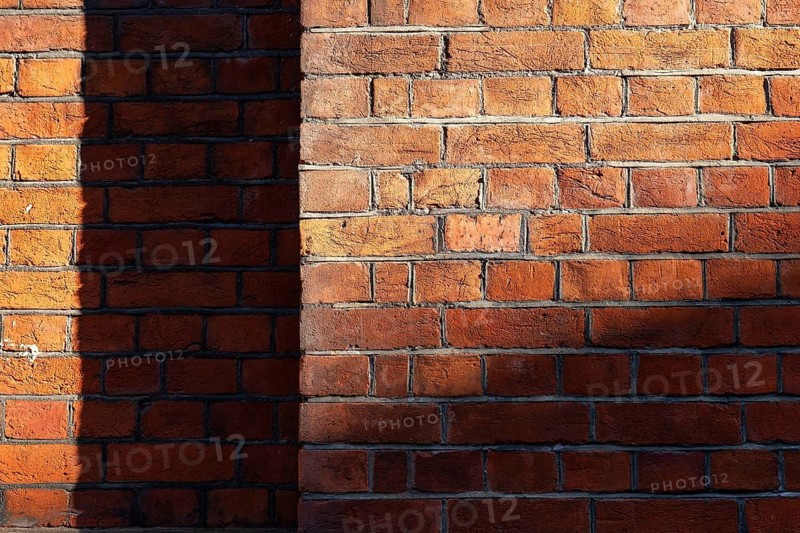 Brick wall made of brown-red, partly shaded bricks, Chelsea, London, England, Great Britain