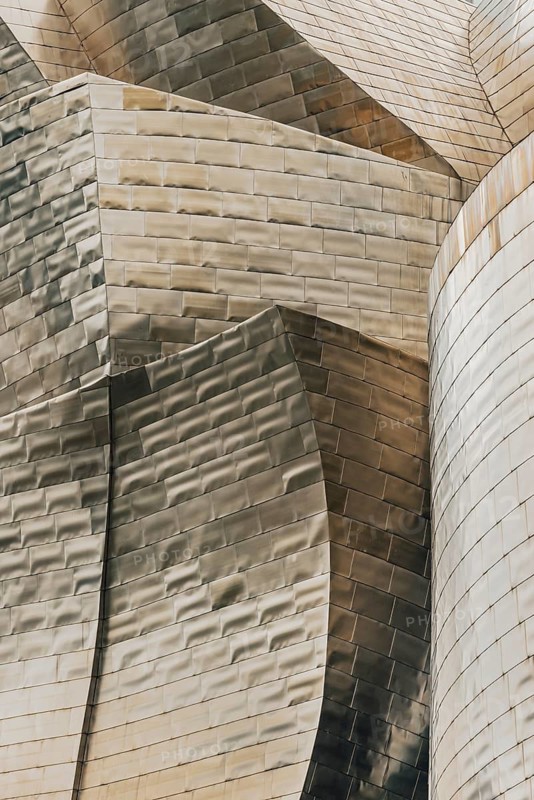 Exterior view of the Guggenheim Museum with light-reflecting titanium plates in Bilbao, Spain
