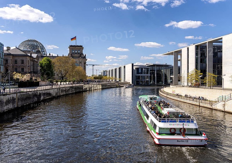 Excursion boat trip on the Spree in Berlin's government district along the Reichstag and the rear house façade of the Marie-Elisabeth-Lüders House, Berlin, Germany
