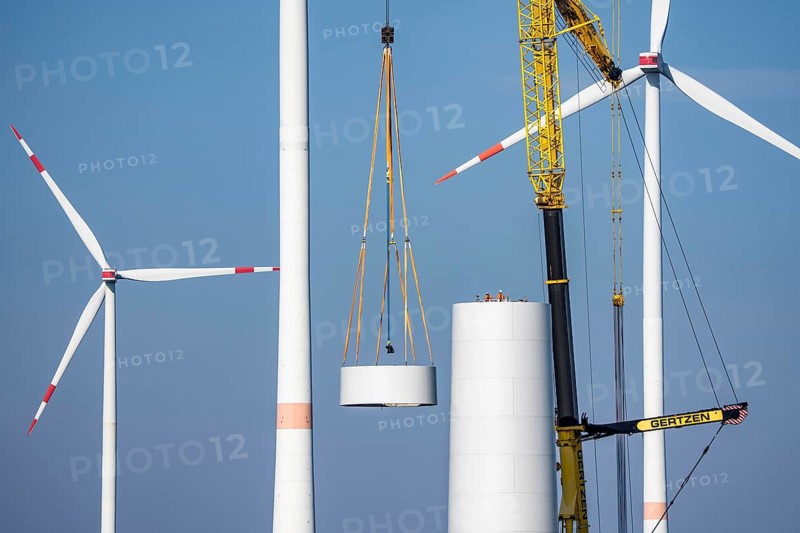 Construction site of the new Bedburg 3 wind farm, on recultivated open-cast mining site, 9 wind power plants with an output of 60 megawatts are being built, installation of the wind turbine tower operated by RWE and the city of Bedburg, North Rhine-Westphalia, Germany
