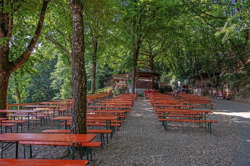 Empty beer tables and benches on a rock cellar, Senftenberg near Buttenheim, Upper Franconia, Bavaria, Germany