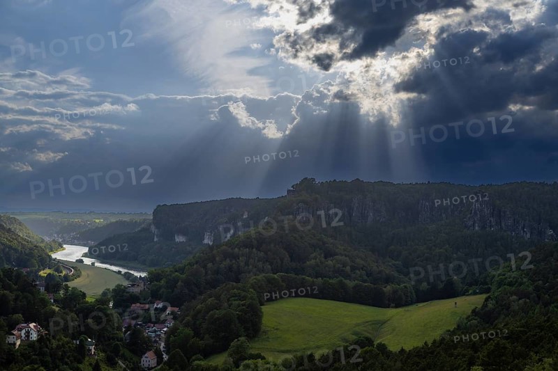 View from Gamrig sandstone rock in rainy weather and sunshine, Rathen, Saxony, Germany