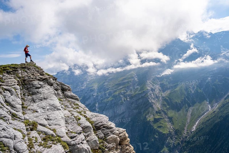 Mountaineers on Tanzbödeli summit in front of mountain landscape, Bernese Alps, Bernese Oberland, Switzerland
