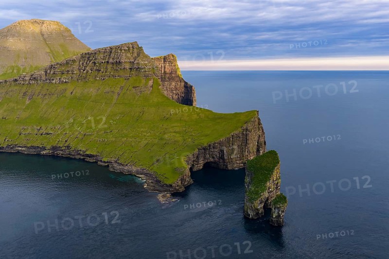 Drangarnir rock formation on the steep coast of the island of Vágar, Faroe Islands, Denmark
