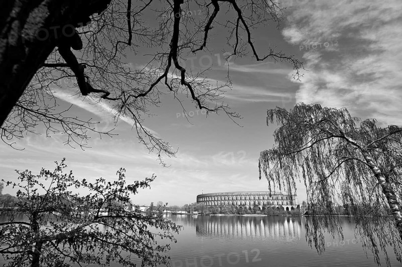 General view of the former incomplete Congress Hall of the NSDAP 1933-1945, in front the bun pond and trees, documentation center, National Party Rally grounds, black and white, Bayernstraße 110, Nuremberg, Middle Franconia, Bavaria, Germany