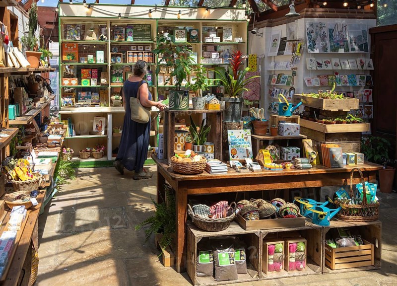 Woman shopping In the gift shop, Chelsea Physic Garden, London, England, UK