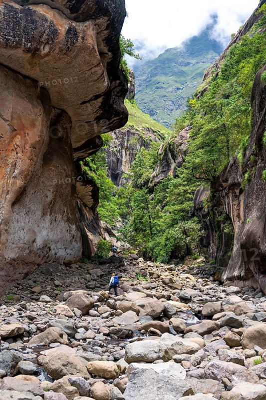 Female hiker in the Tugela Gorge or Tugela Gorge in the riverbed, Drakensberg National Park, KwaZulu Natal, South Africa
