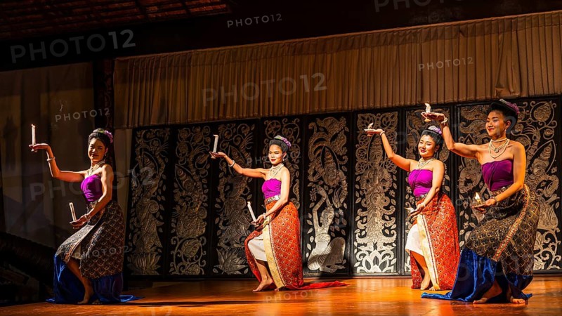 Young Thai women in traditional dress showing a traditional dance, Old Chiang Mai Cultural Center, Chiang Mai, Thailand