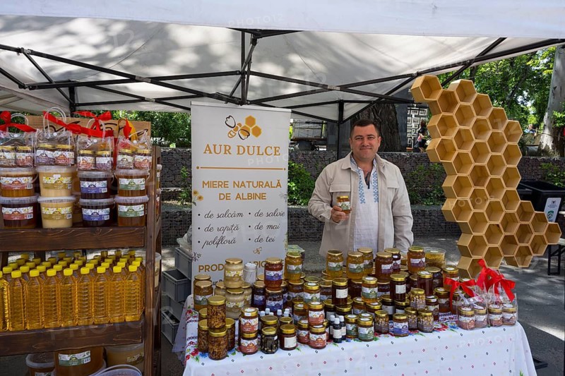 A stand with various types of honey at an outdoor market, folklore festival, Chisinau, Chisinau, Chisinau, Republic of Moldova, Moldova, Eastern Europe
