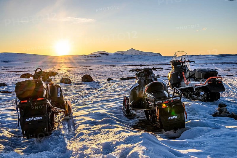 Flatruet, Ljungdalen, Jämtlands län, Sweden, snowmobiles standing on a snowy area at an atmospheric sunset, Flatruet, Berg, Härjedalen Län, Sweden
