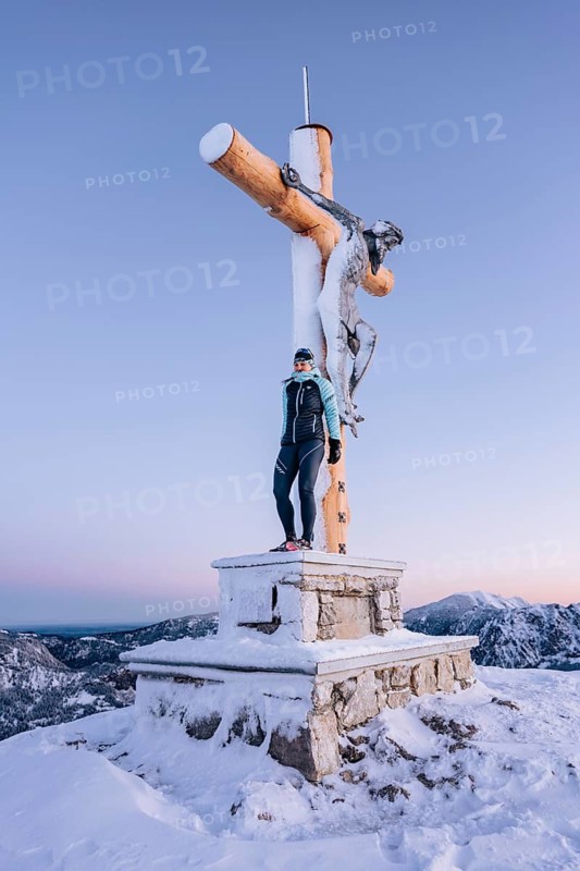 Summit bliss in the snow-covered winter landscape in the Tannheimer Tal in the Alps on the Neunerköpfle, Tyrol, Austria