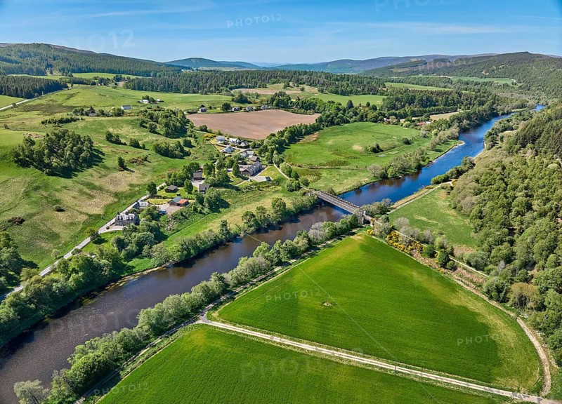 Aerial drone view of the forest and pasture landscape at Spey River in eastern Scotland, UK