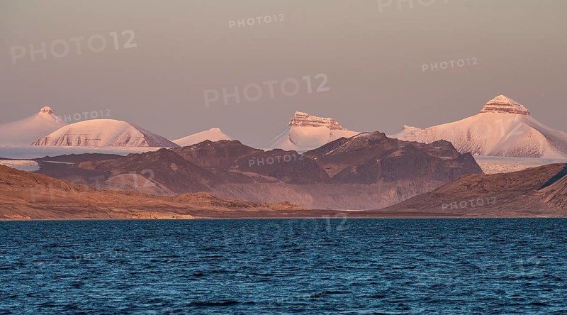 Tre Kroner (Three Crowns) mountain peak: Svea, Dana and Nora (representing Sweden, Denmark and Norway), warm September light, Kongsfjorden, the Svalbard archipelago, Svalbard, Norway