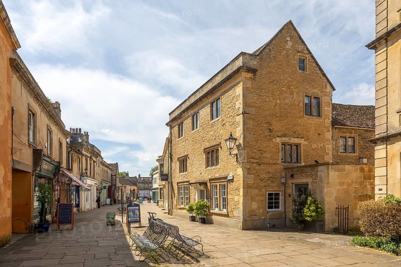 Historic buildings in pedestrianised area of High Street, town centre of Corsham, Wiltshire, England, UK