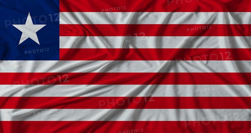 Liberia flag with fabric texture background. National flag of Liberia with cloth texture