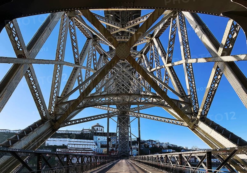 Ponte Dom Luis I arched bridge designed by Théophile Seyrig, looking up from the lower level towards Vila Nova de Gaia, Porto, Portugal