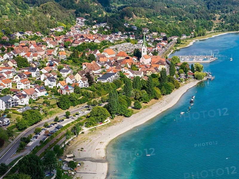 City view of Sipplingen on Lake Constance with church and marina. aerial view. Sipplingen, Baden-Württemberg, Germany