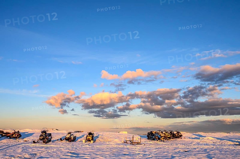 Ljungdalen, Jämtlands län, Sweden, snowmobiles stand on a snowy area under a bright blue sky with scattered clouds, Flatruet, Berg, Härjedalen Län, Sweden